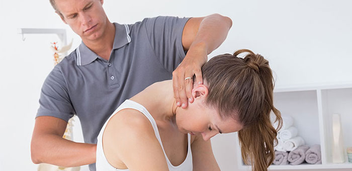 Woman receiving chiropractic adjustment from a Denver chiropractor