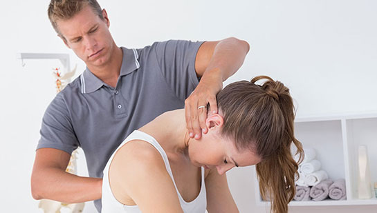 Woman receiving chiropractic adjustment from a Denver chiropractor