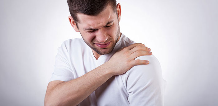 Man suffering from frozen shoulder before visiting Denver chiropractor