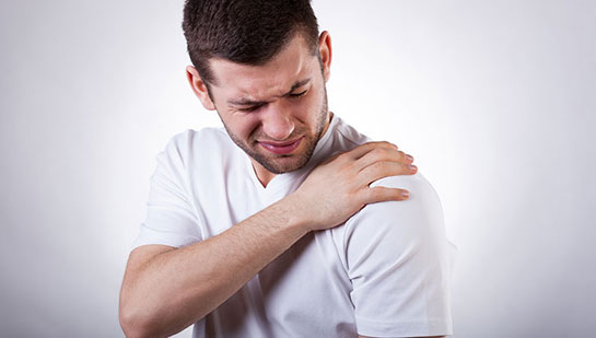 Man suffering from frozen shoulder before visiting Denver chiropractor