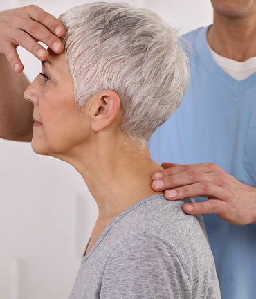 Patient receiving chiropractic adjusmtent for migraine relief from Denver chiropractors